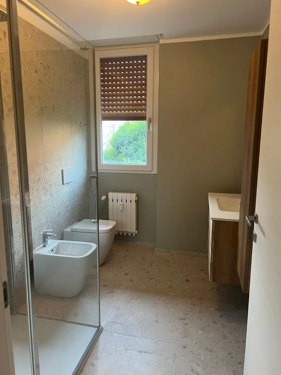 Bathroom with shower and fixtures