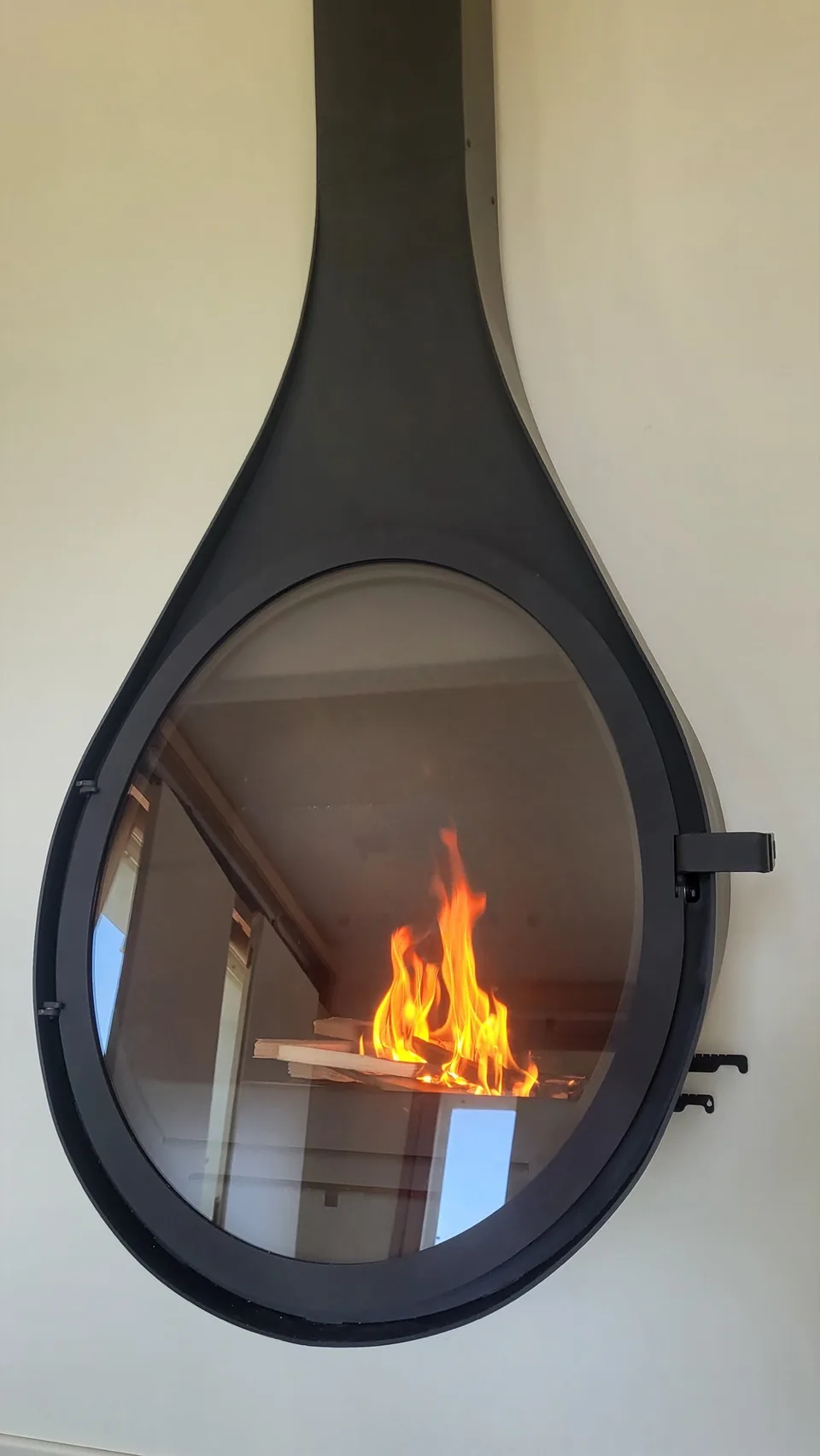 Lit suspended fireplace in the living room